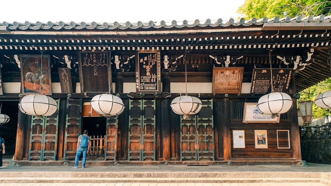 Tōdai-ji Temple entrance with traditional lanterns and wooden architecture in Nara, Japan.