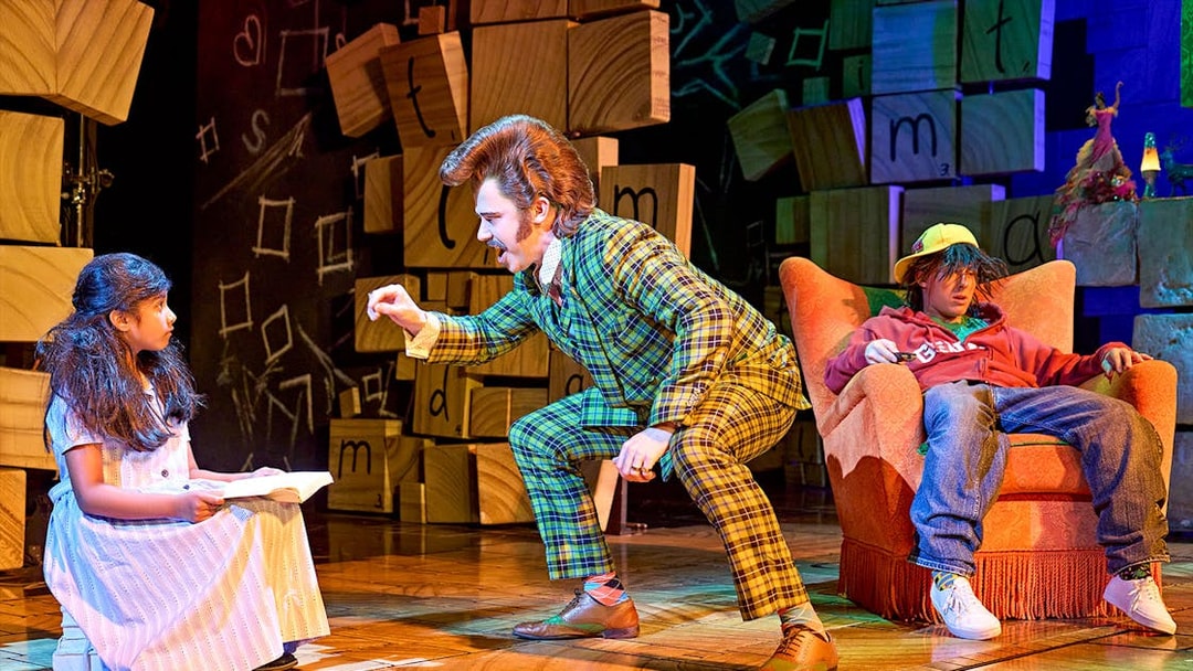 Matilda The Musical scene with characters interacting on stage.