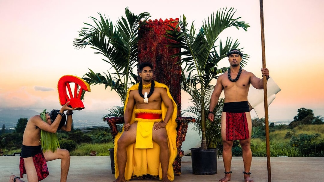 Mauka Warriors performing a cultural play with traditional attire and props.