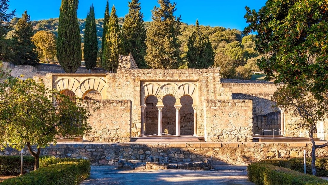 Medina Azahara ruins with arches and trees in Cordoba, Spain.