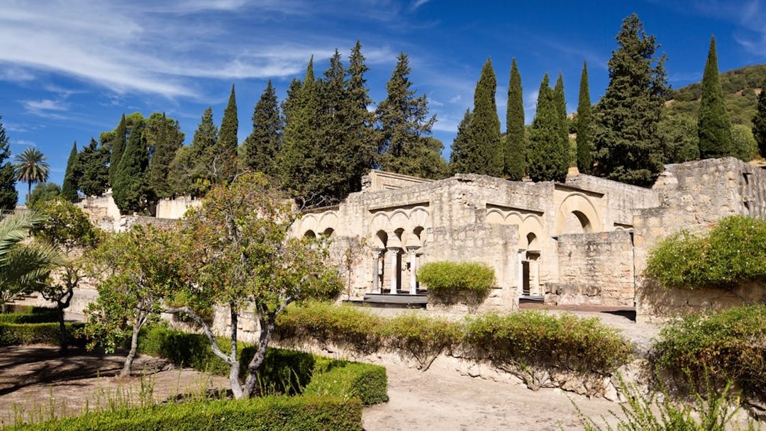 Medina Azahara ruins with cypress trees in High Garden, Cordoba.