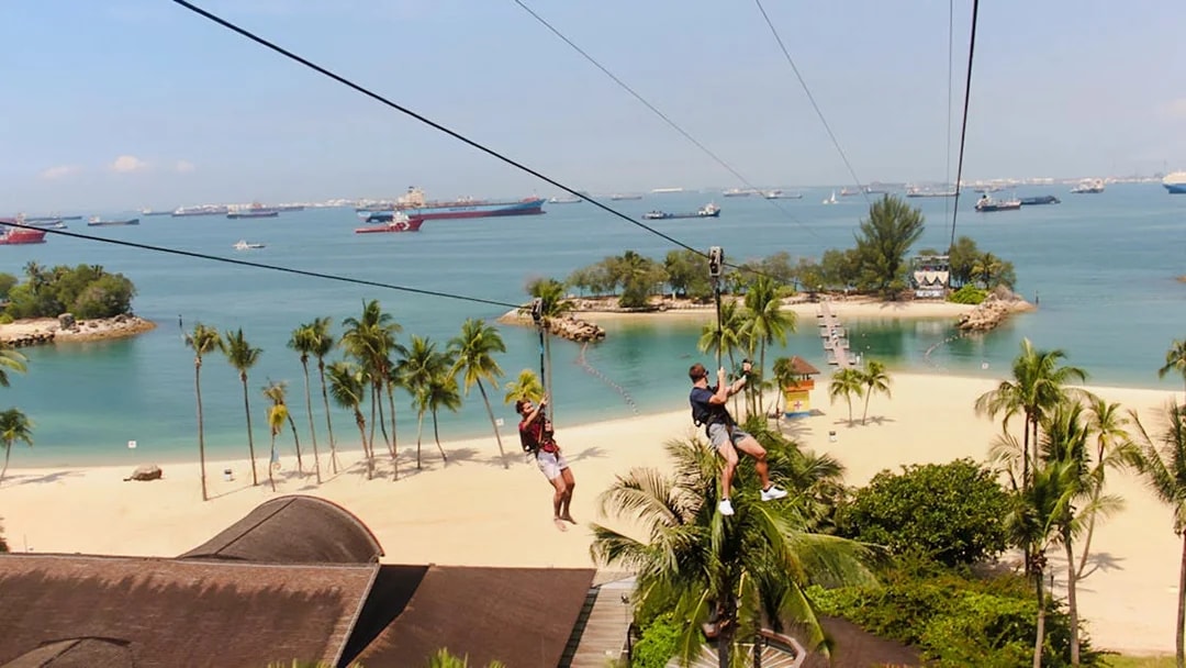 Ziplining over Sentosa Beach at Mega Adventure Park, Singapore.