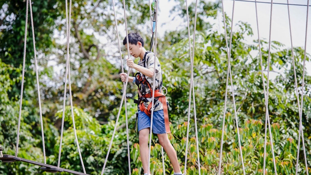 Participant navigating rope course at Mega Adventure Park Singapore.