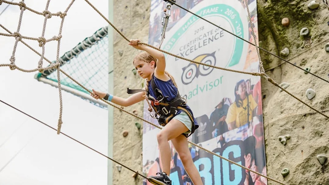 Child navigating rope course at Mega Adventure Park Singapore.