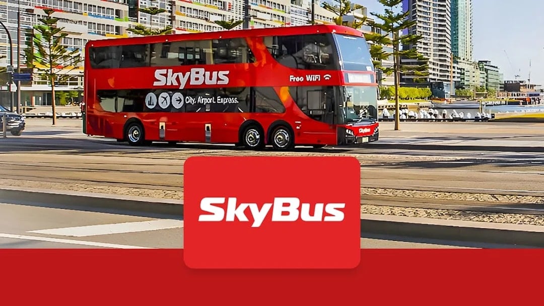Skybus double-decker shuttle in Melbourne city, offering airport transfers.