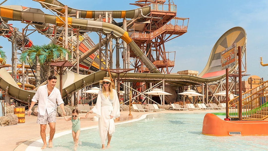 Family enjoying water rides at Meryal Waterpark.