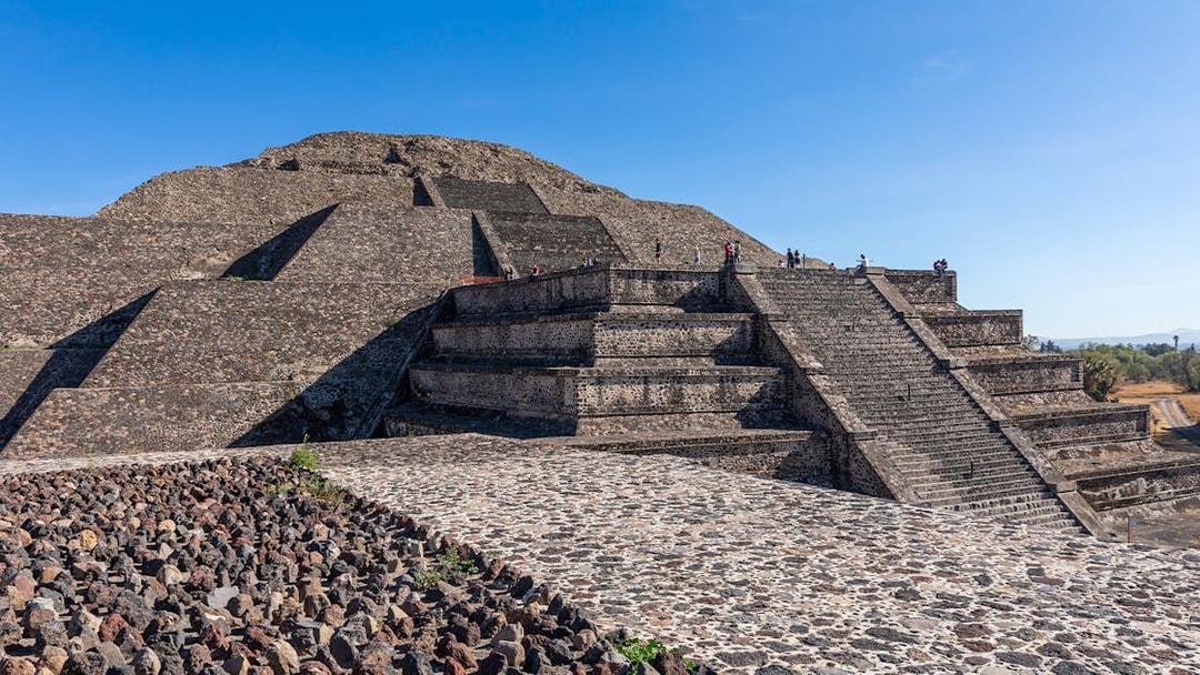 People climbing the Pyramid of the Moon in Teotihuacan, Mexico.