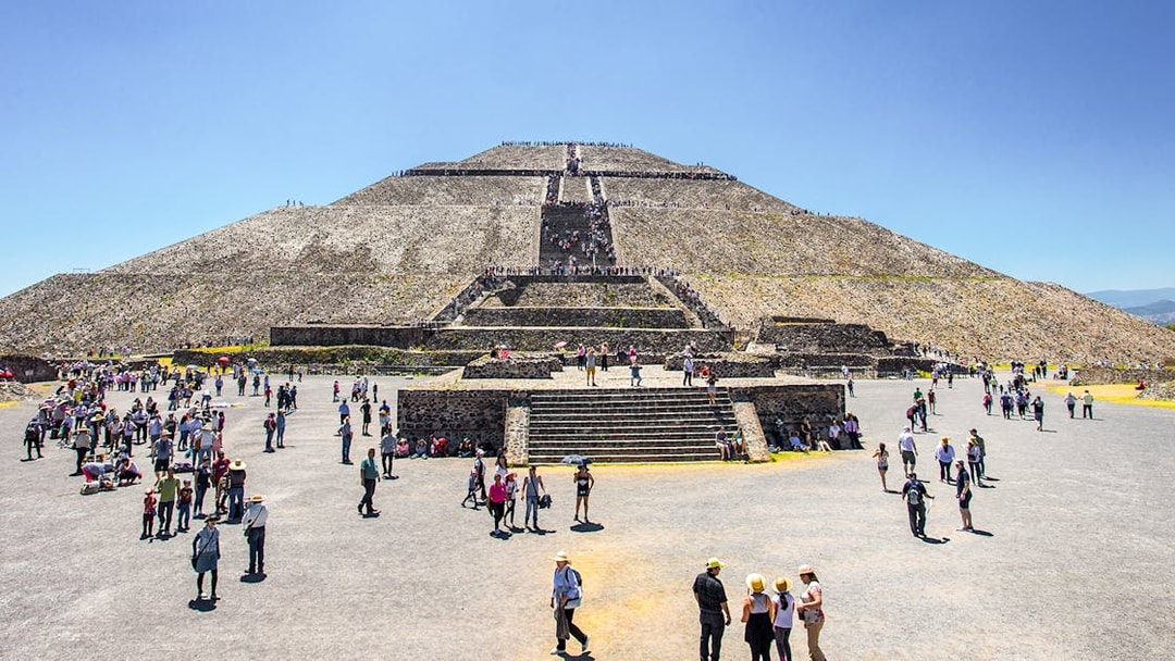 Visitors exploring the Sun Pyramid at Teotihuacan, Mexico.