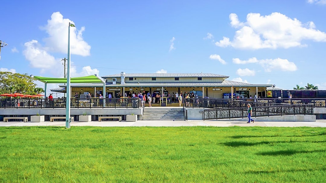 Holiday Park entrance with visitors gathering for airboat tour and wildlife show.
