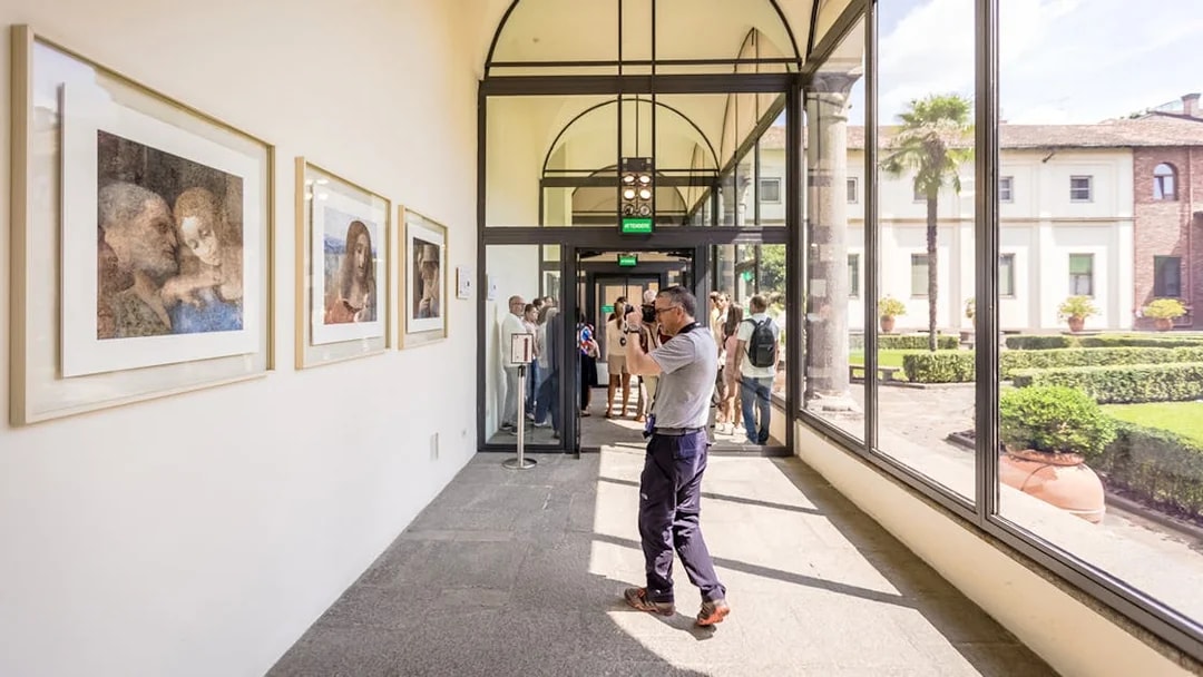 Tourists viewing art at The Last Supper Museum, Milan.