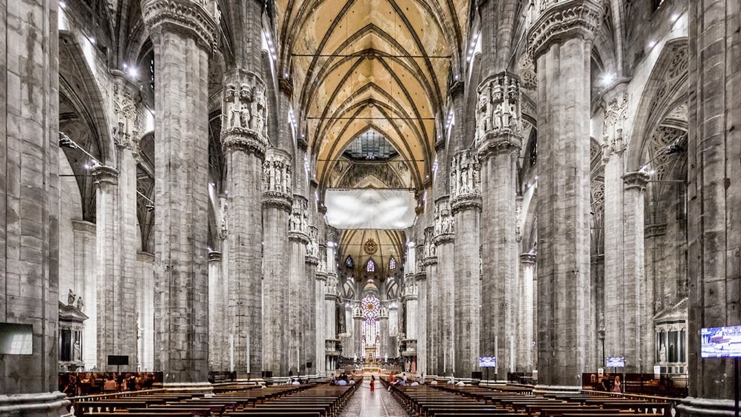 Duomo Cathedral Milan interior with ornate columns and detailed ceiling.