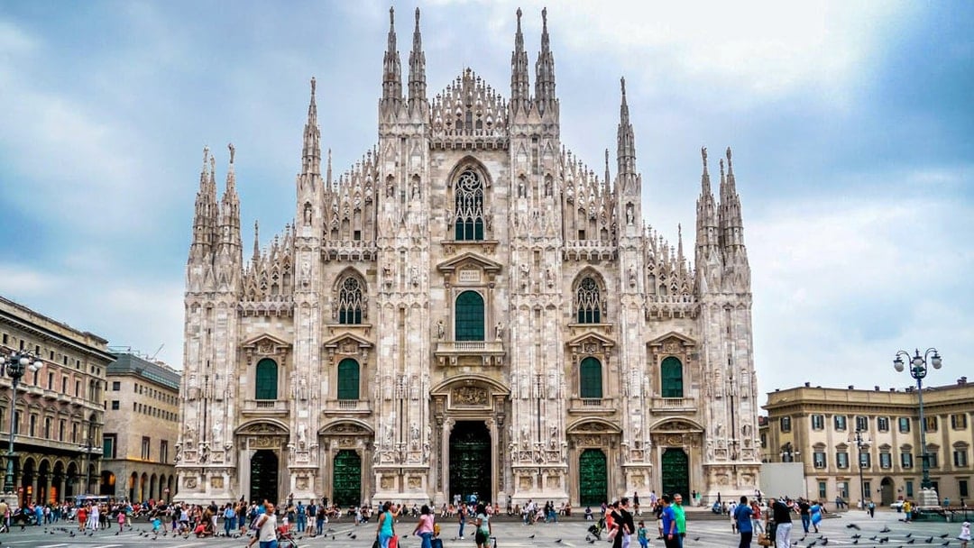 Milan Cathedral facade with tourists in Piazza del Duomo during self-guided audio tour.