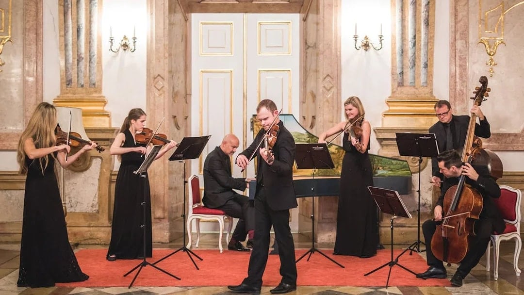 Classical musicians performing at Mirabell Palace concert hall.