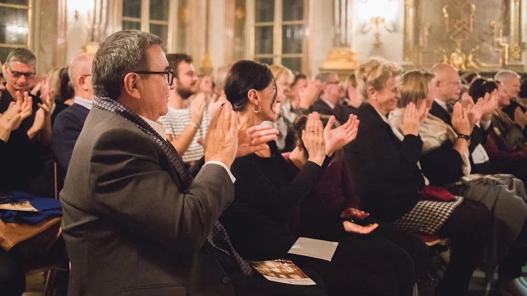 Audience applauding musicians at Mirabell Palace concert hall, Salzburg.