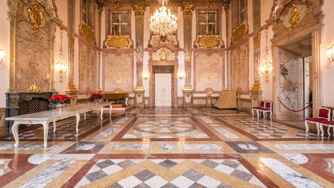 Mirabell Palace concert hall with ornate decor and chandelier in Salzburg.