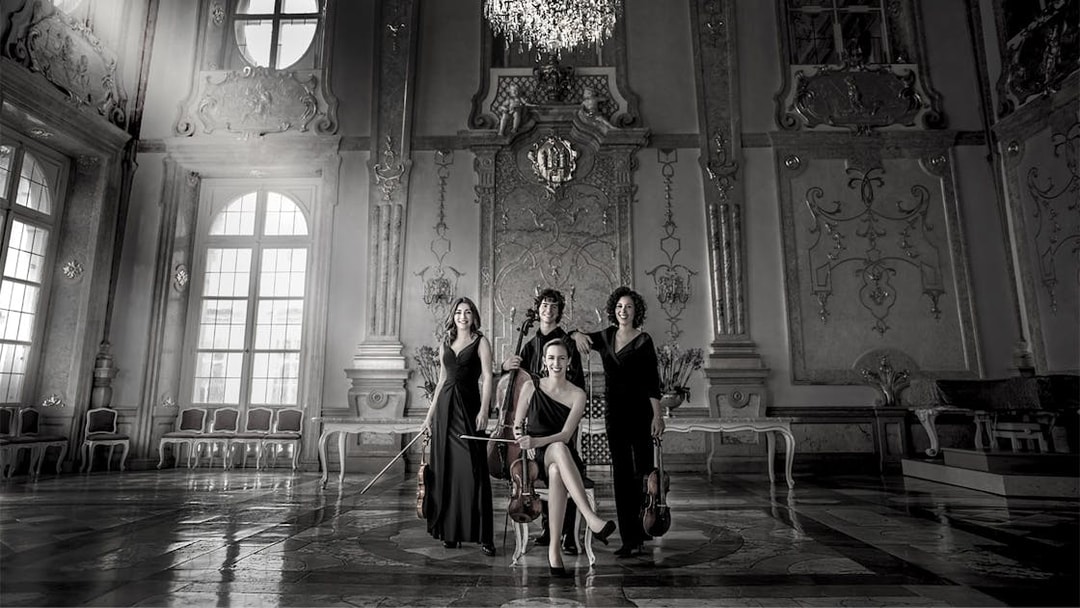 Musicians with string instruments in Mirabell Palace concert hall, Salzburg.