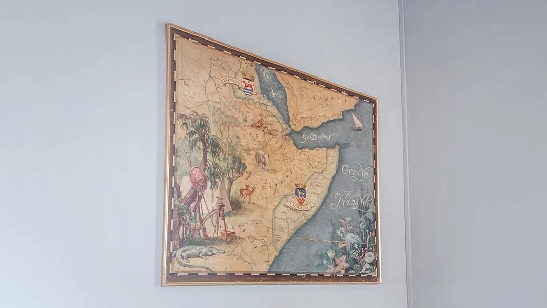 Old Ethiopian map displayed at Miramare Castle, featuring detailed illustrations and geographic labels.