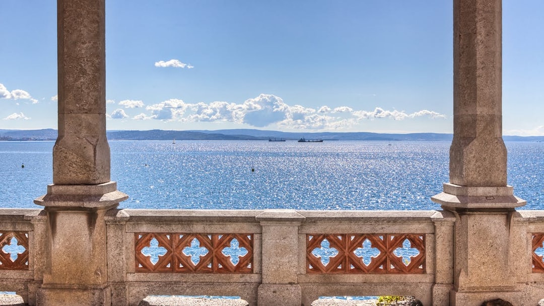 Balcony view of the sea from Miramare Castle, Trieste, with distant ships.