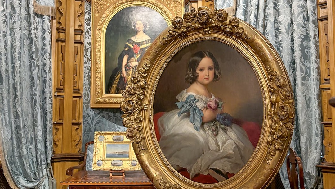 Miramare Castle paintings featuring portraits in ornate frames.