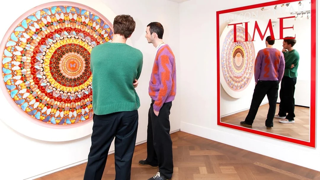Visitors viewing contemporary art at Moco Museum, Amsterdam, featuring Banksy pieces.