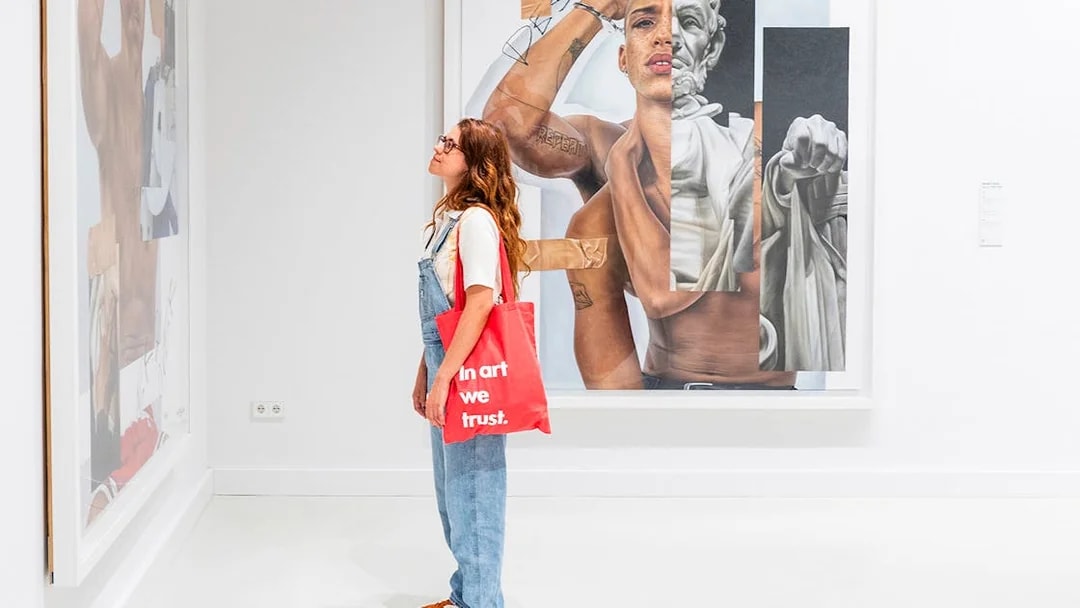 Visitor viewing Robin Kid artwork at Moco Museum, Barcelona.