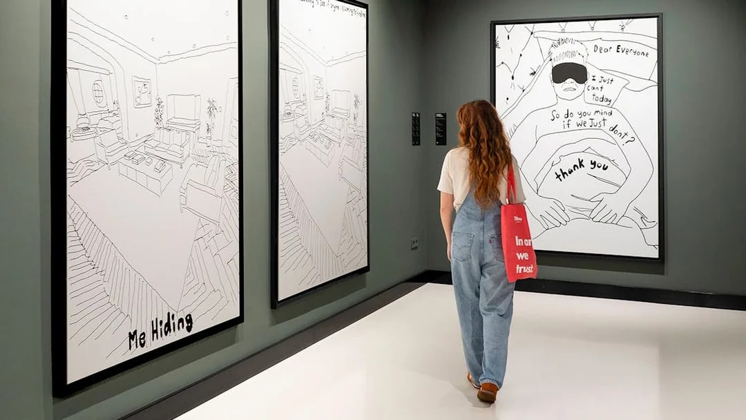 Visitor viewing Banksy artworks at Moco Museum Barcelona.