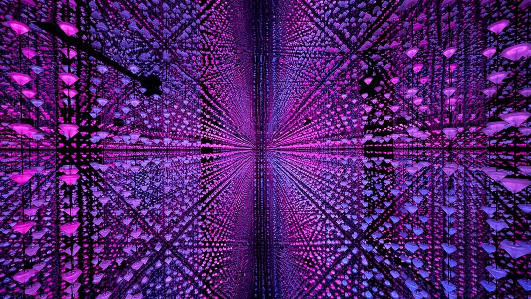 Visitors experiencing digital immersive art at Moco Museum, Barcelona.