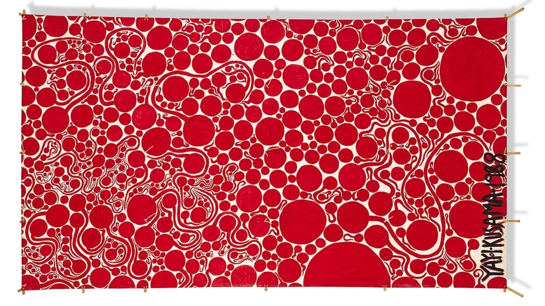Red polka dot artwork by Yayoi Kusama at Moco Museum London.