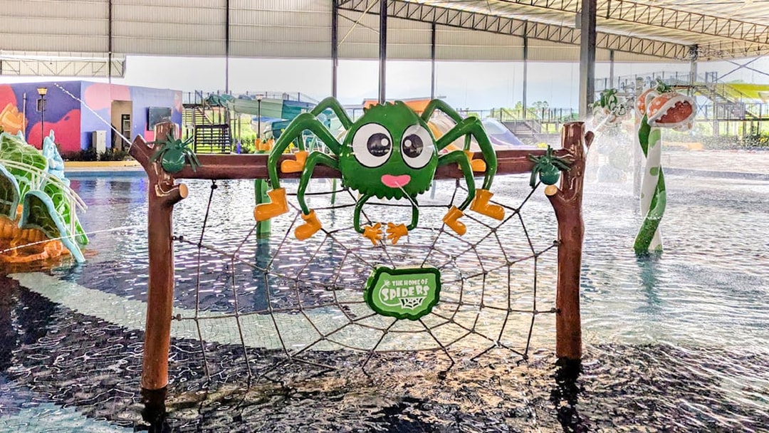 Spider-shaped play structure at Monkey Splash Zone water park.