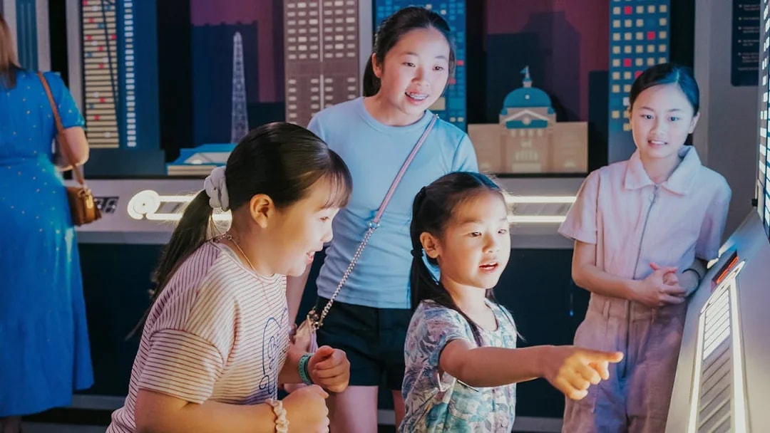Children interacting with an electric piano at Monopoly Dreams Melbourne.