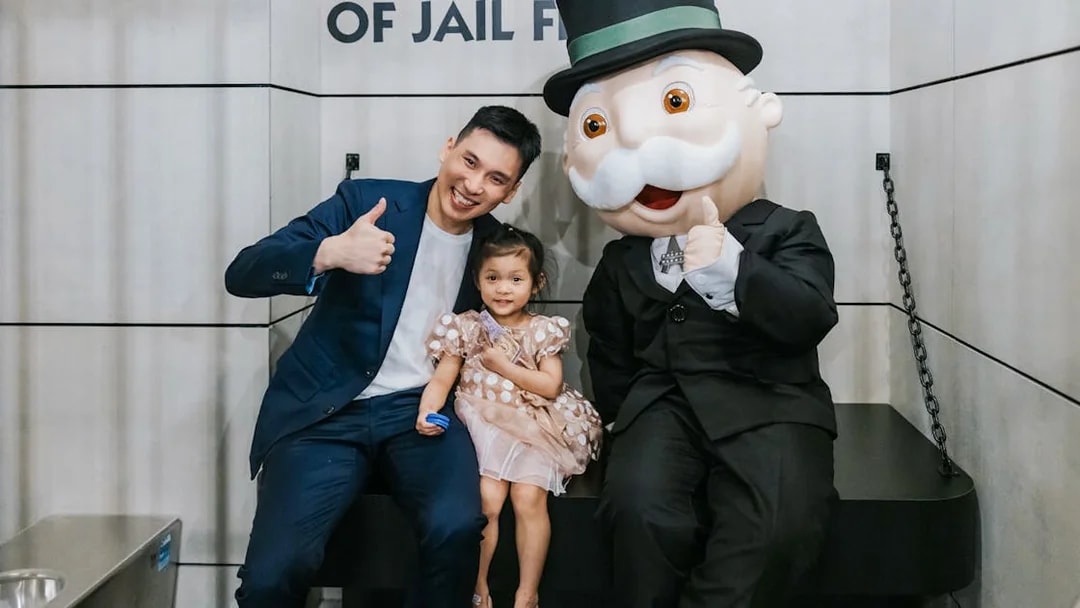 Man and child with Monopoly mascot at Monopoly Dreams Melbourne.