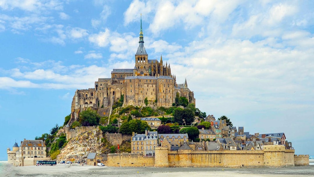 Mont Saint-Michel island with abbey and surrounding village, France.