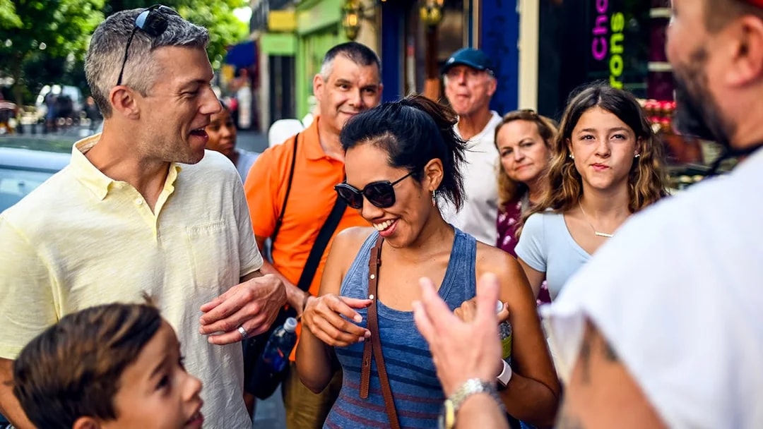 Group enjoying a guided food tour in Montmartre, Paris.