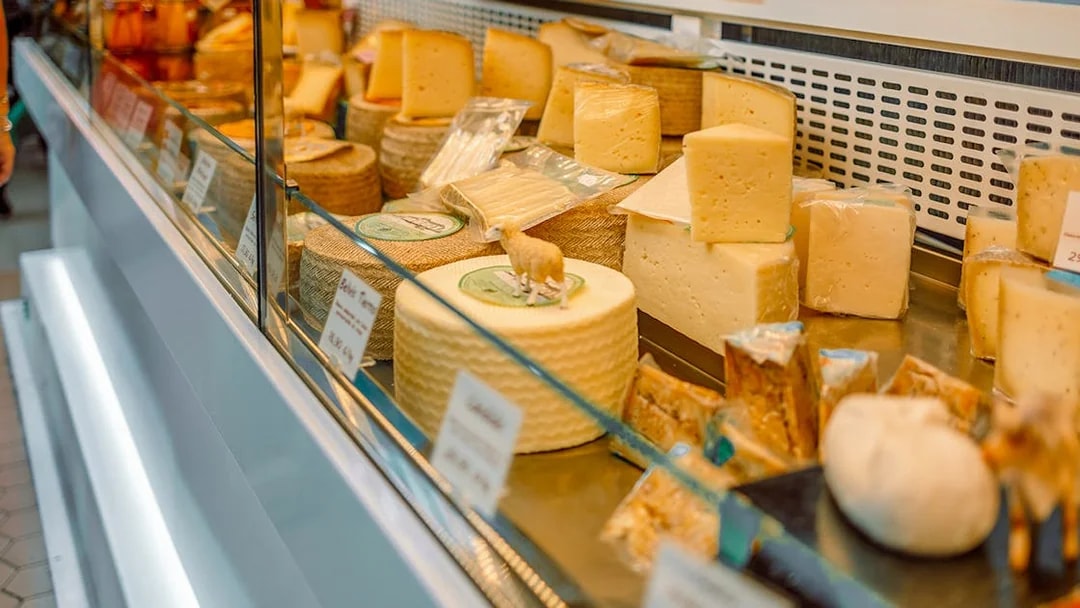 Cheese selection at a shop in D’Aligre Market, Paris.