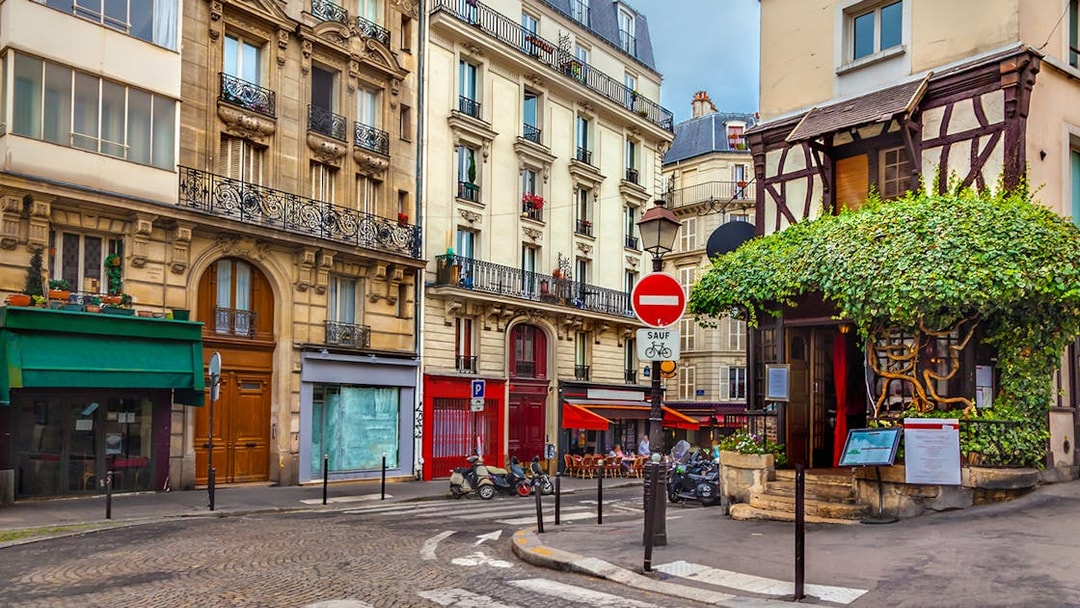 Montmartre street with shops and cafes, Paris.