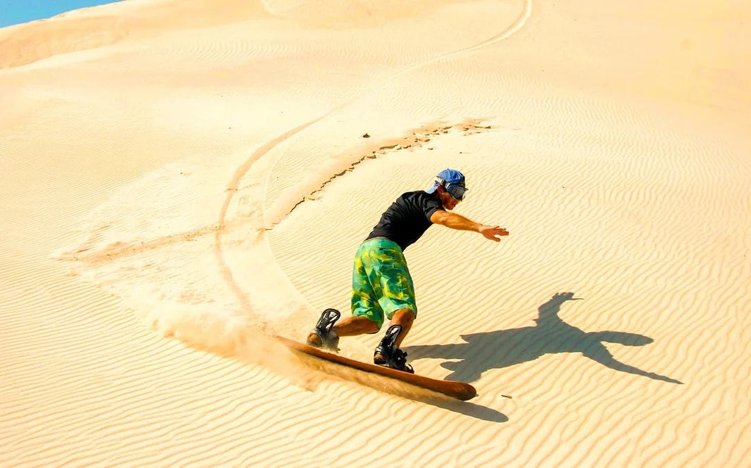 Morning Desert Safari with Camel Farm Visit & Sandboarding Image 4