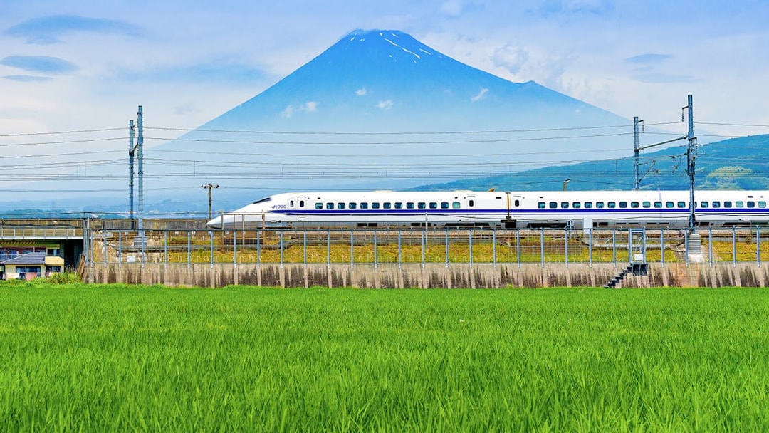 Bullet train passing in front of Mount Fuji on route to Tokyo.