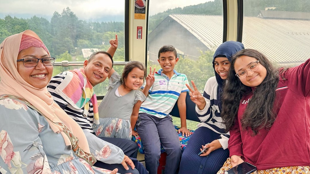 Family enjoying a cable car ride on Mount Fuji and Hakone Premium Tour.