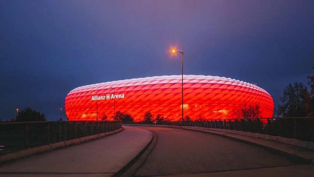 Allianz Arena illuminated at night in Munich, Germany.