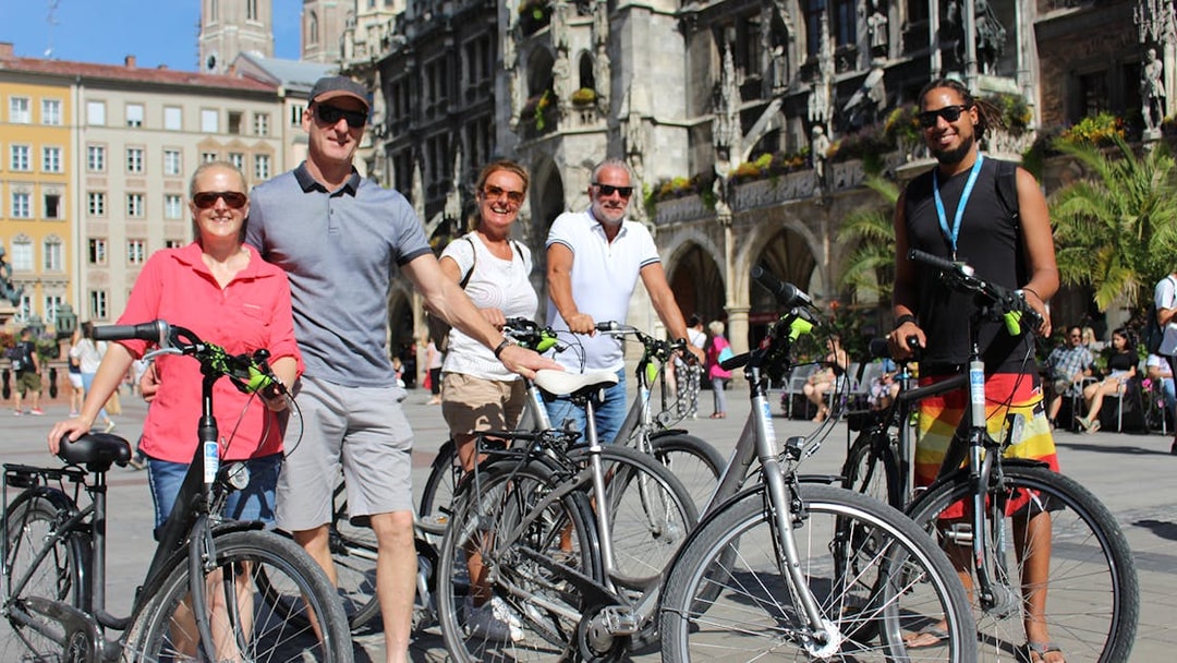 Group of cyclists in Marienplatz, Munich during a bike tour.