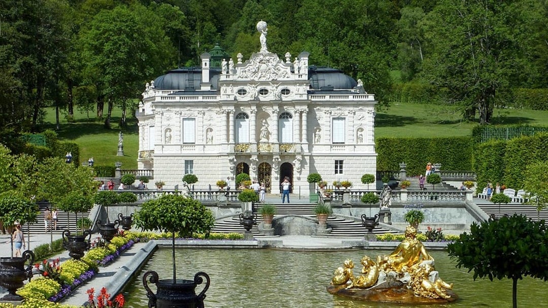 Linderhof Palace with gardens and fountain, part of a day trip from Munich.