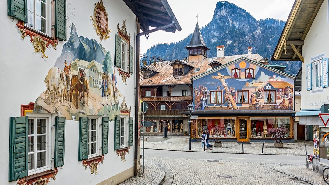 Street view in Bavarian village with painted murals, en route to Linderhof and Neuschwanstein castles from Munich.