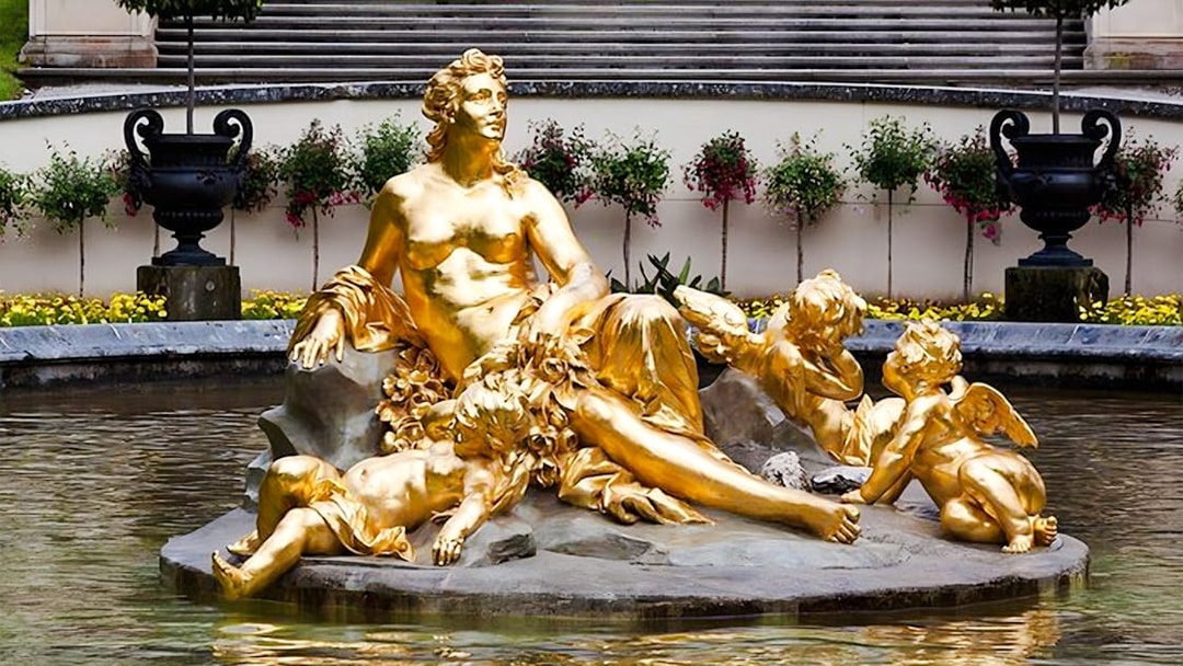 Golden statue in the fountain at Linderhof Palace, Germany.