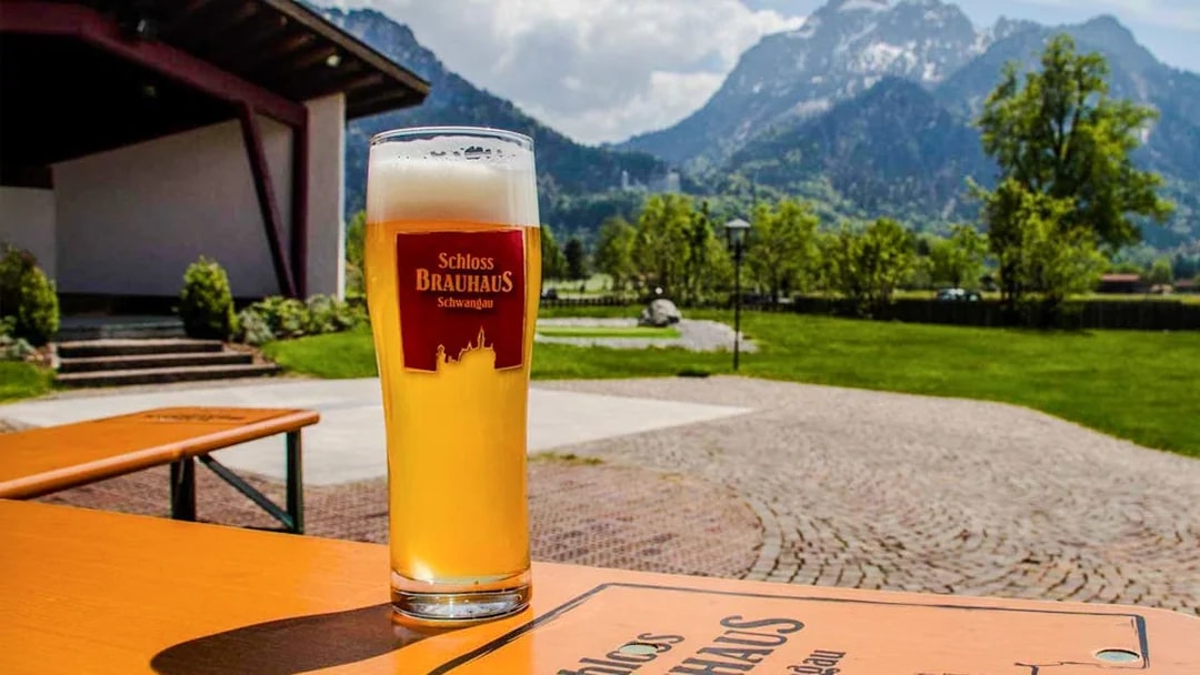 Bavarian beer at Schloss Brauhaus Schwangau with mountain view near Neuschwanstein Castle.