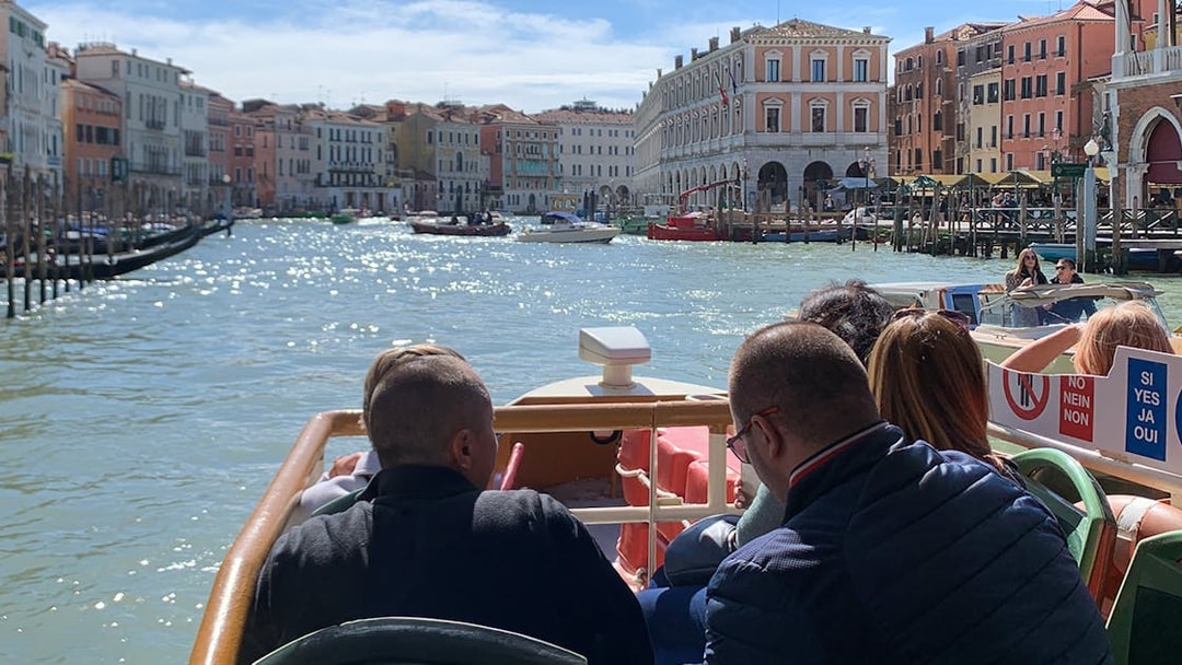 Guests on Vaporetto ACTV cruising the Grand Canal in Venice, Italy.