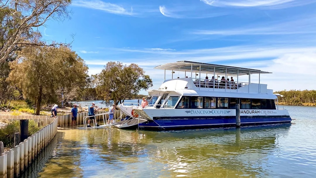 Cruise boat docked on the Murray River with passengers boarding for a lunch tour.