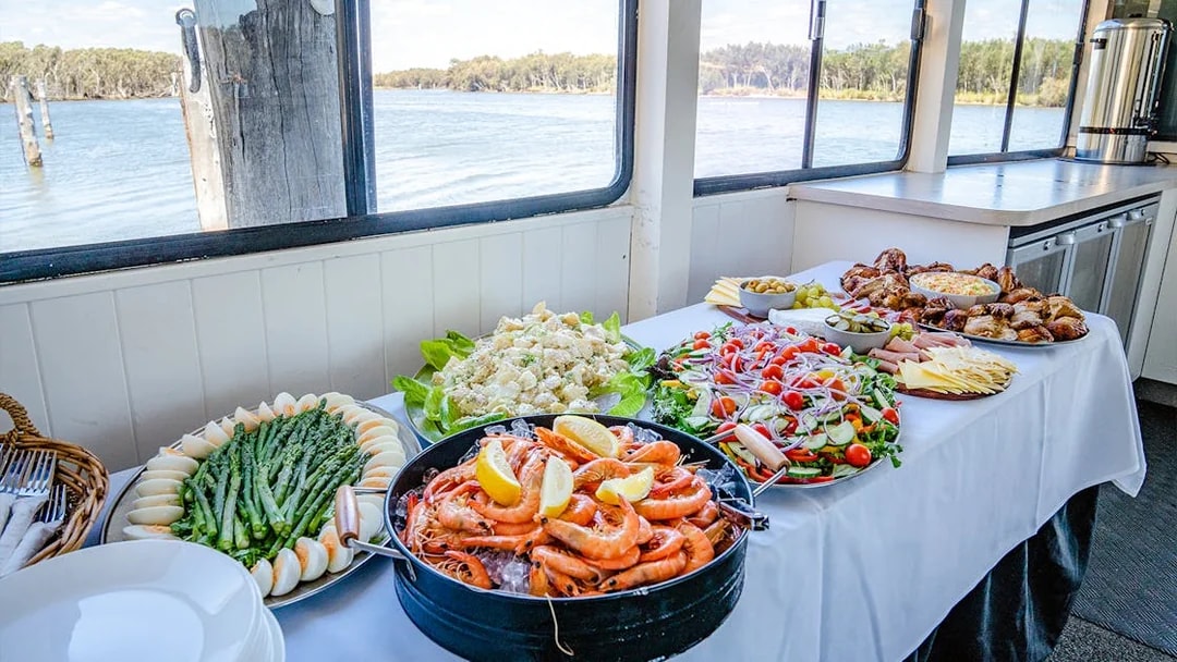 Lunch buffet with seafood, salads, and meats on a Murray River cruise.