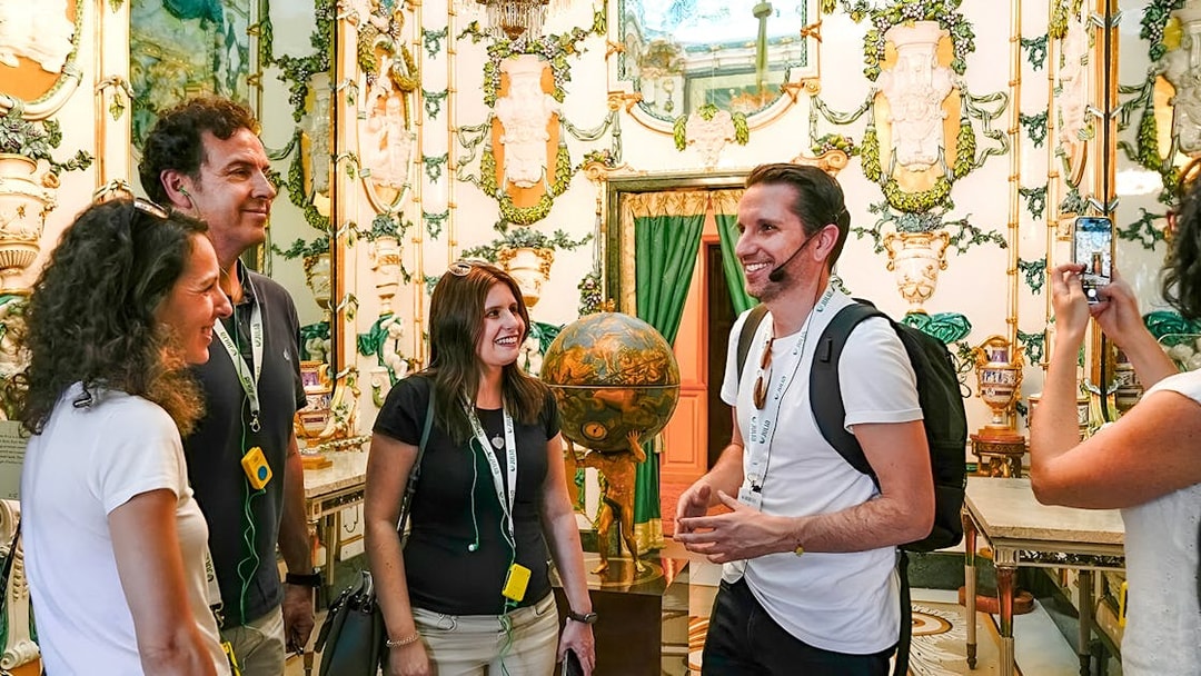 Tour group enjoying a guided visit inside the Royal Palace of Madrid.