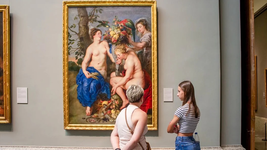 Visitors viewing a painting at Prado Museum, part of the "Skip The Line" Royal Palace + Prado Museum tour.