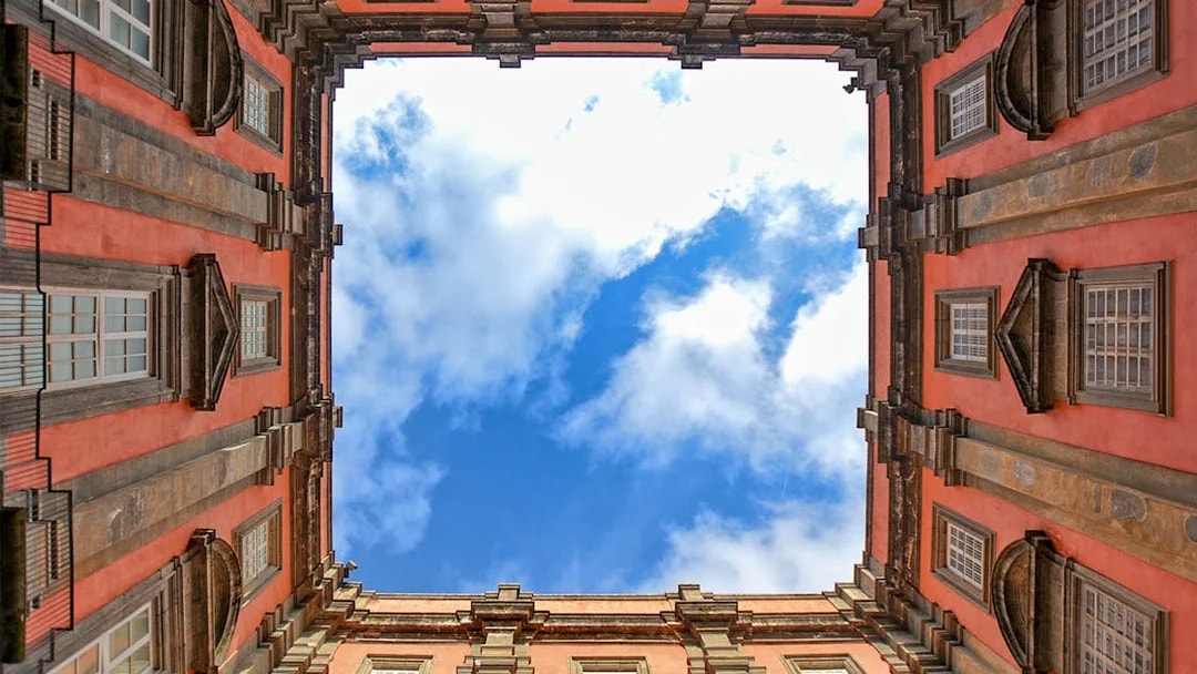 View of the sky framed by the courtyard of Museo di Capodimonte, Naples.